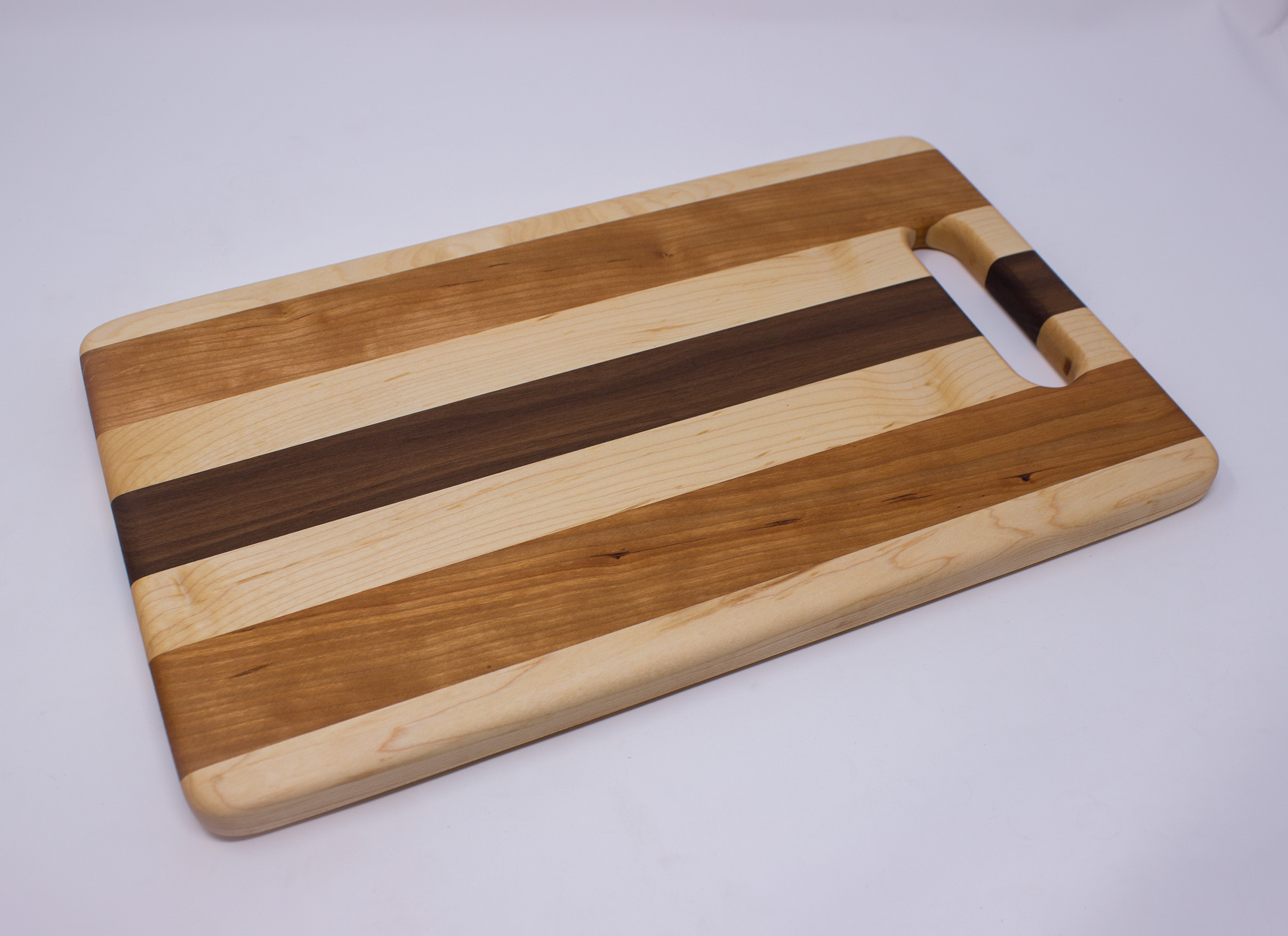 Maple, Cherry and Walnut with Handle Cutting Board